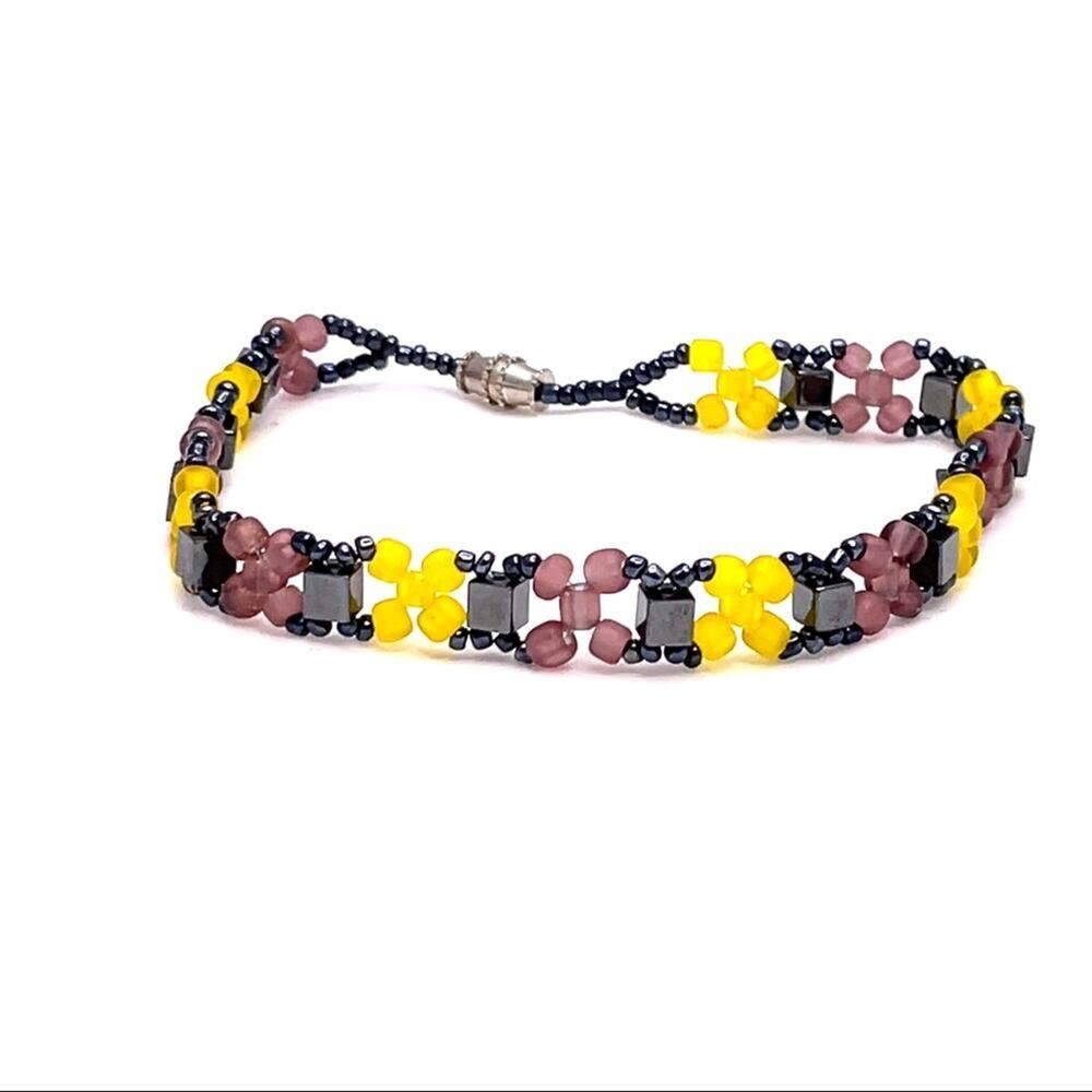 Beaded grey yellow and purple bracelet flower